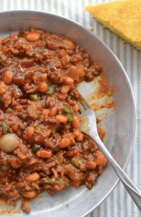 Chili with beans in a metal bowl.